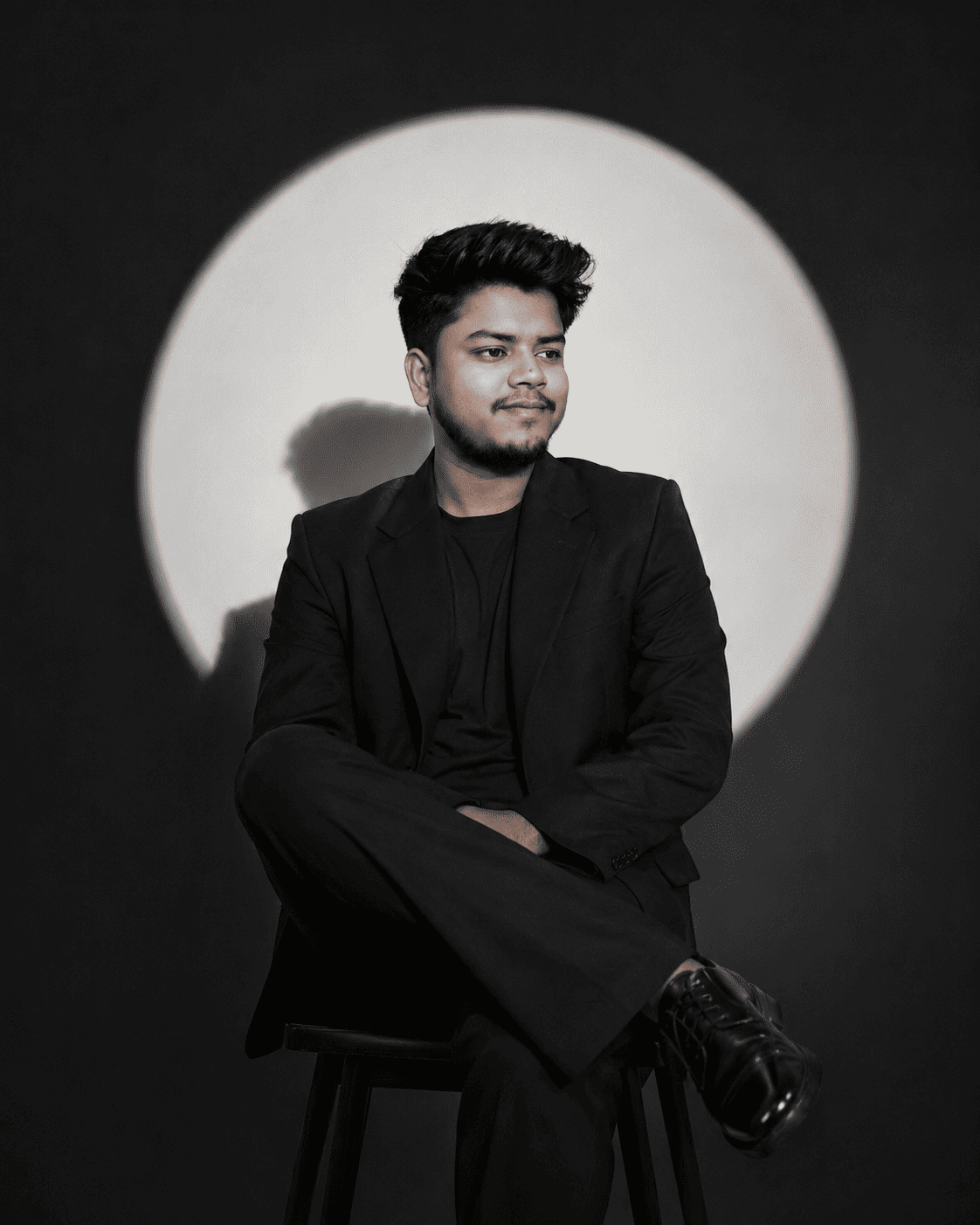 Young Man in Black Suit – Cinematic Studio Portrait Prompt