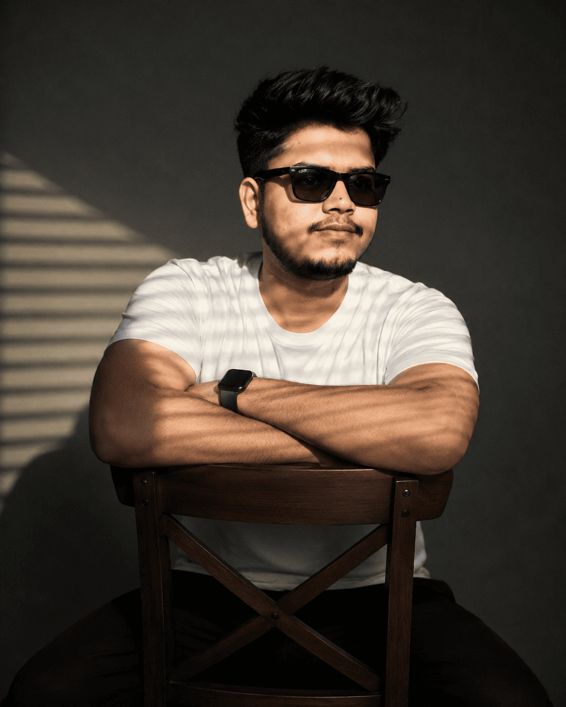 Cinematic Portrait of Man in White T-Shirt with Sunglasses – Moody Indoor Photography Prompt
