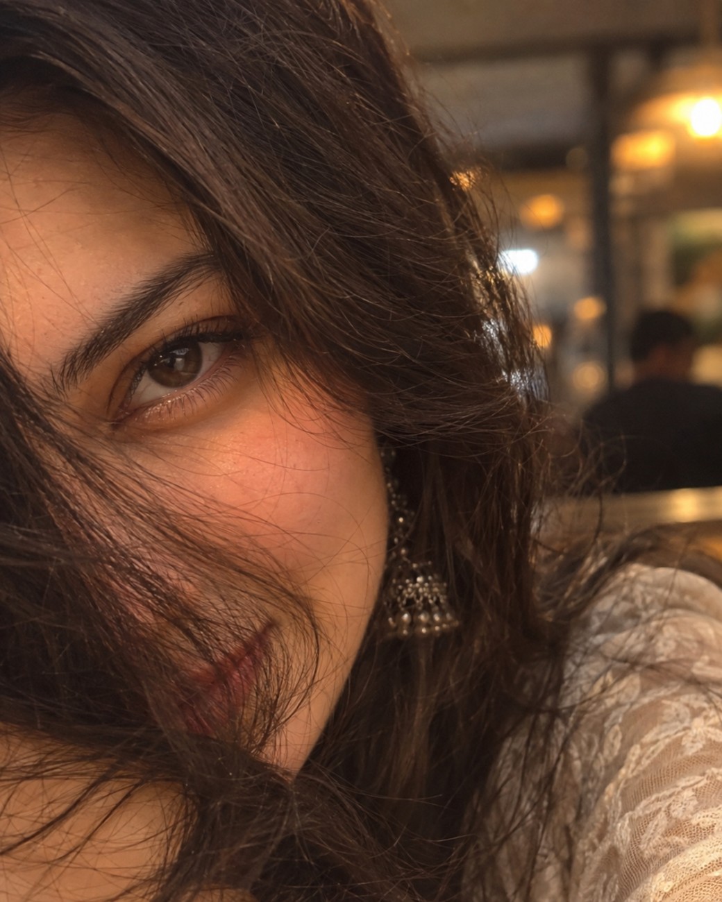 Ultra-Realistic Close-Up Woman Portrait – Cinematic Hair & Warm Cafe Lighting AI Prompt