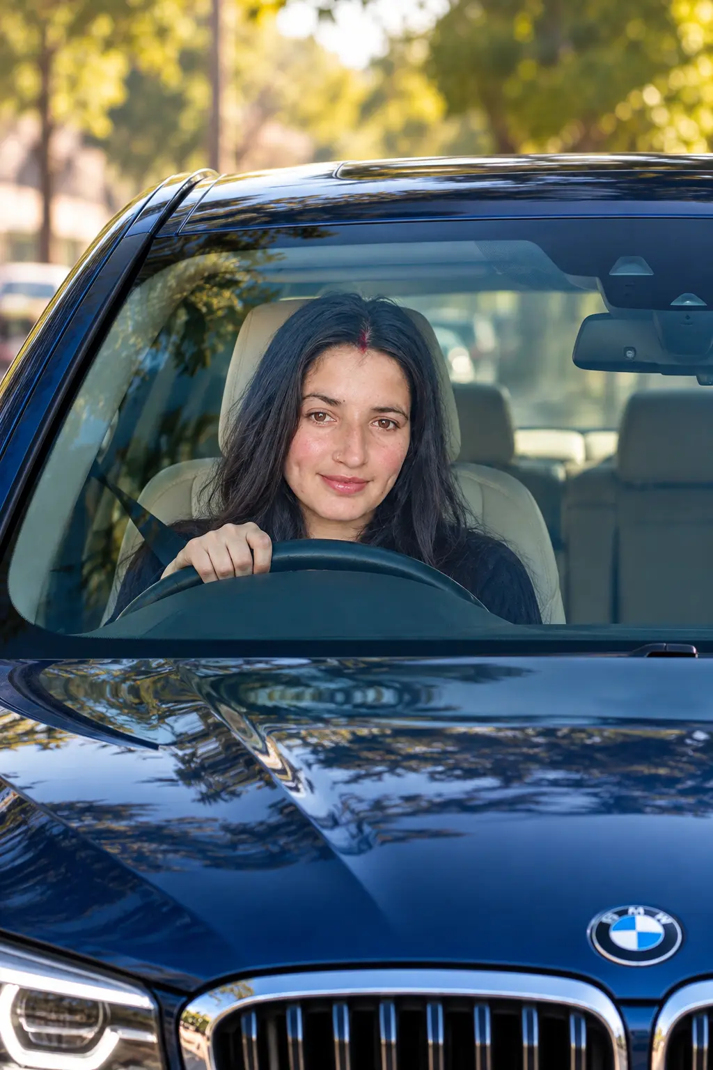 Smiling Woman in a Blue BMW
